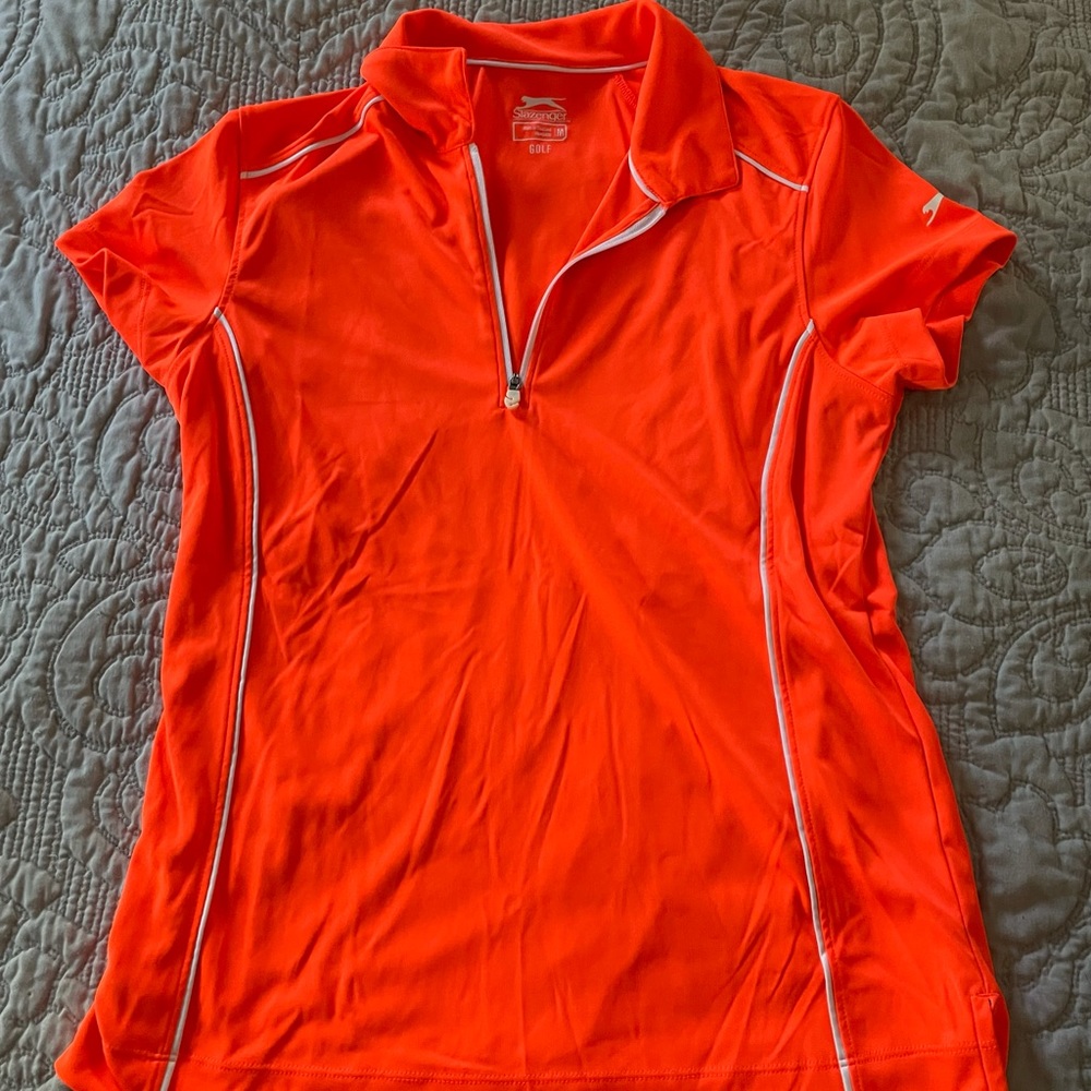 Slazenger golf tee. Neon orange quarter zip